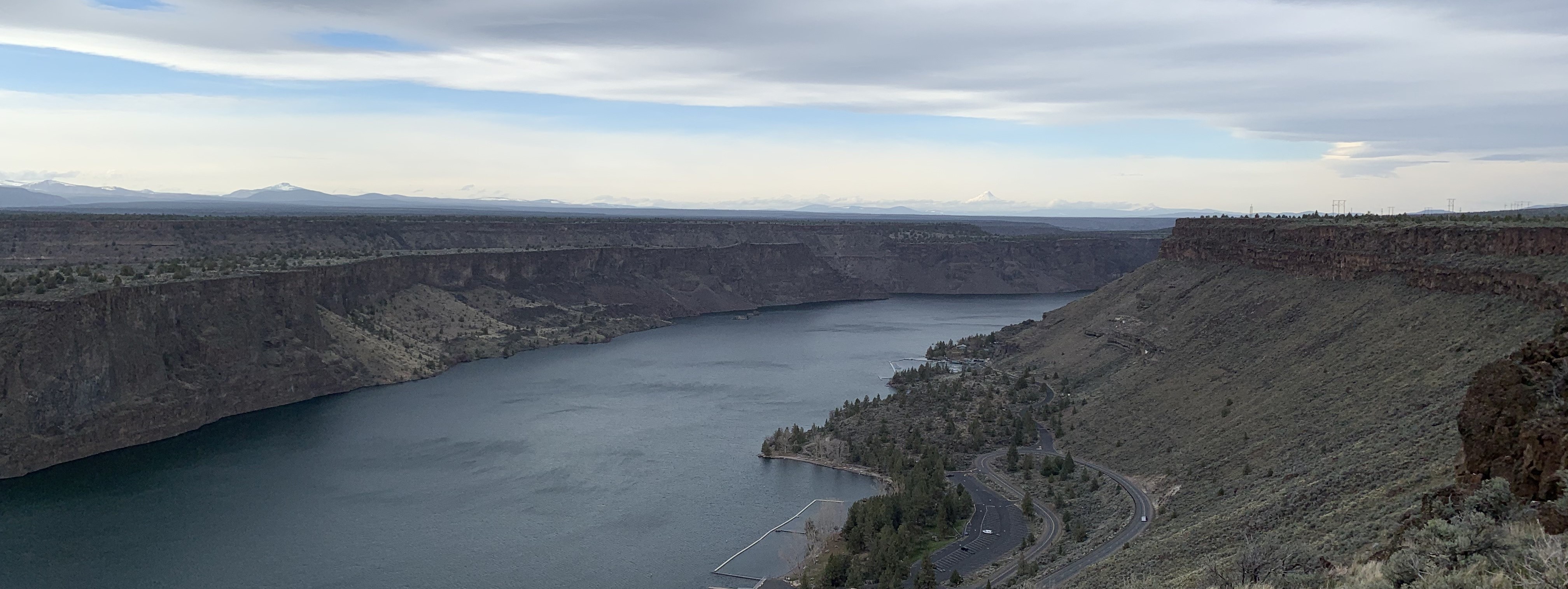 Wide shot overlooking river with gray overcast sky