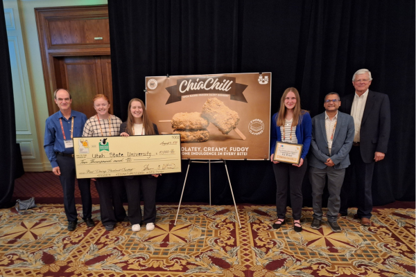 From left to right, Eric Bastian, Josie Sorensen, Taelie Kennedy, Sarah Petmecky, Prateek Sharma, and Alan Reed pose with the ChiaChill poster.