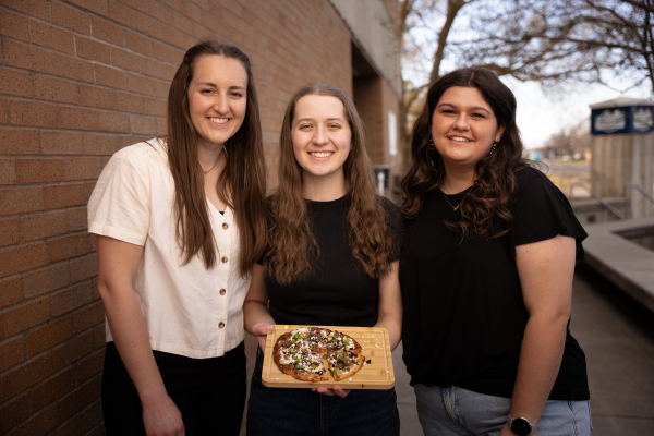 2026 product development team poses with their award winning pizza called athena's slice