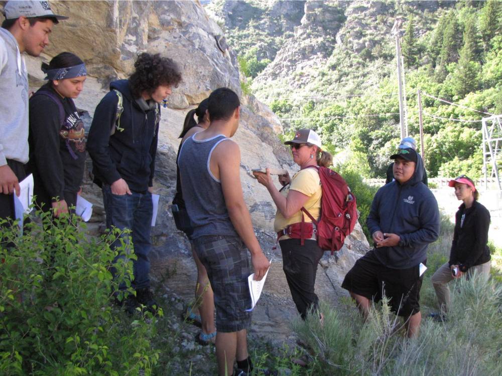 Students examining rock